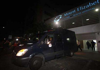 A file photo of a police van carrying the body of the Indian rape victim leave Mount Elizabeth Hospital for the morgue in Singapore.