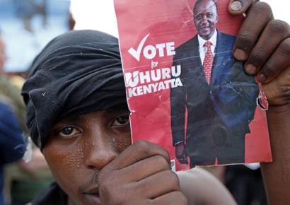 A supporter of presidential candidate Uhuru Kenyatta celebrates on the outskirts of Nairobi.