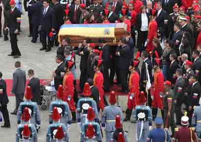 Pallbearers carry the coffin of Venezuela's late President Hugo Chavez to a hearse prior to a funeral parade in Caracas March 15, 2013, in this picture provided by the Miraflores Palace.