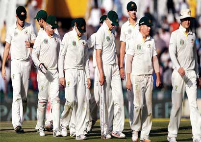 The Australian team walks back after losing the third Test against India by six wickets.