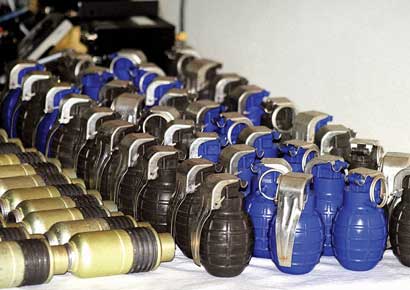 Police display arms and ammunition recovered from one of the arrested militants in Srinagar on Tuesday.