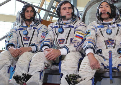 Flight Engineer Sunita Williams of NASA, Soyuz Commander Yuri Malenchenko and Japan Aerospace Exploration Agency Flight Engineer Aki Hoshide answer questions from the media at a Soyuz vehicle mock-up before their final qualification test June 20, 2012 at the Gagarin Cosmonaut Training Center in Star City, Russia.