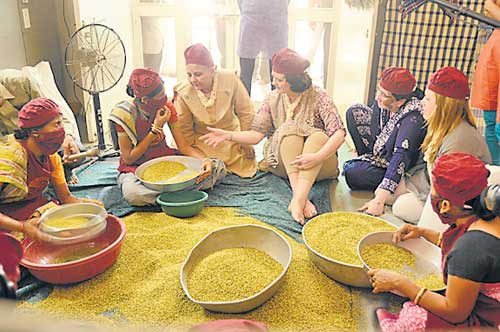 Cherie Blair gets a closer look at how SEWA workers operate