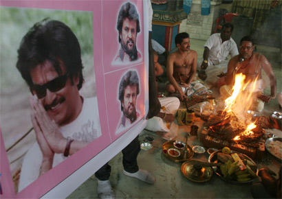 Fans of Tamil superstar Rajinikanth, who has been admitted to the intensive care unit of a Chennai hospital following a recurrent respiratory infection and gastro-intestinal problems, pray for his speedy recovery at a havan in Dharavi on Thursday, May 19, 2011.