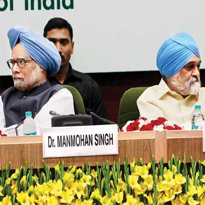 Prime minister Manmohan Singh and deputy chairman of the Planning Commission Montek Singh Ahluwalia at the International Workshop on Green National Accounting for India, in New Delhi on Friday