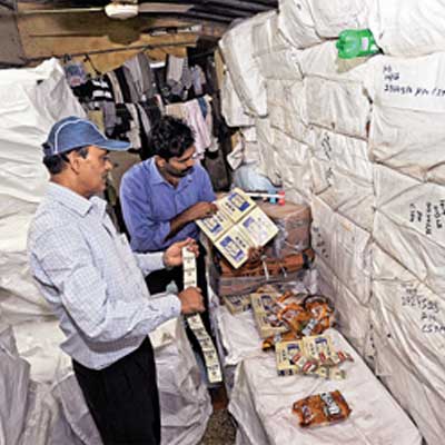 FDA officials check the seized consignment in Dongri on Saturday