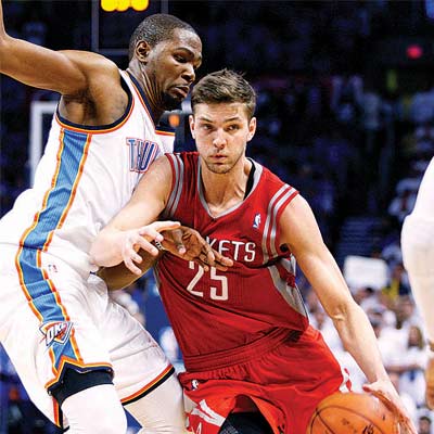 Houston Rockets guard Chandler Parsons (right) vies with Oklahoma City forward Kevin Durant in Game Two of Western Conference playoffs on Wednesday.