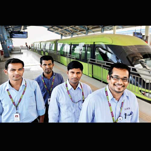 (From left) Ashish Phatak, Rajesh Adhav and Mukesh Gupta, the first three Indian captains of India�s first monorail, with their Malaysian trainer and seniormost captain Paul Raju at Wadala depot on Friday.