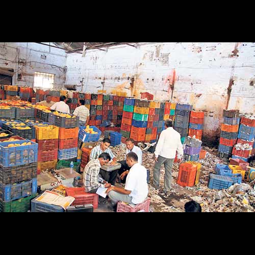 AMC officials at a godown.
