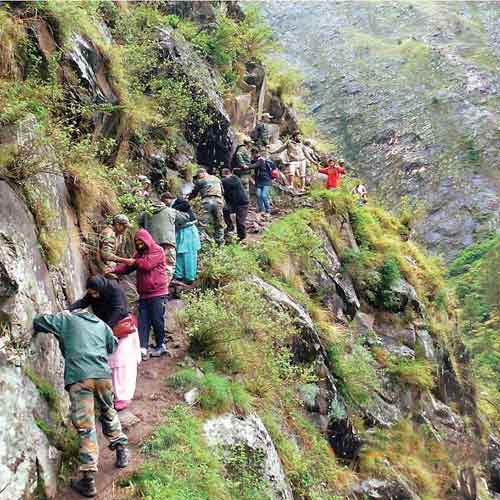 A file photo of stranded tourists being rescued by army personnel in Uttarakhand. The rescue operation is one of the largest in several decades. Courtesy: Indian Army 
