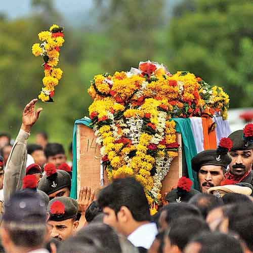 Indian Army soldiers carry the coffin of their colleague Naik Kundalik Mane during the funeral procession at Pimpalgaon village, in Maharashtra, on Thursday. Mane was among five jawans killed in Poonch on Tuesday.