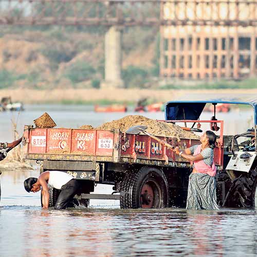 Illegal sand mining taking place at Bhadreshwar riverbank.