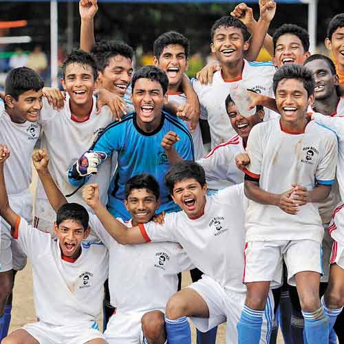 Don Bosco players celebrate their fifth successive MSSA U-16 title after
defeating St Stanislaus on Wednesday .