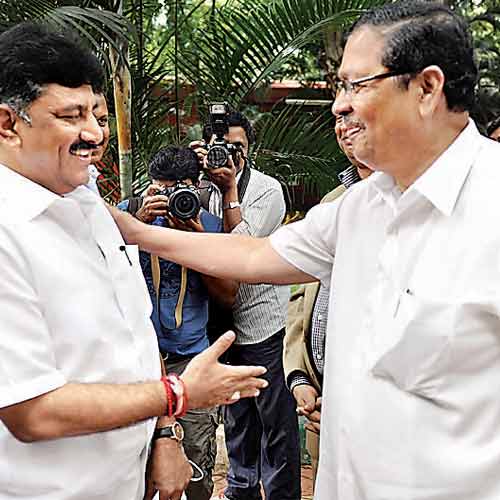 Congress leader DK Shivakumar and former Lokayukta Justice Santosh Hegde ran into each other at Press Club of Bangalore on Wednesday.