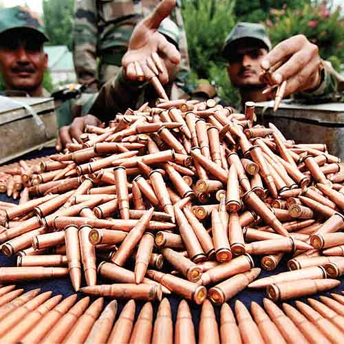 Army officials display arms and ammunition recovered from militants killed in recent operations.