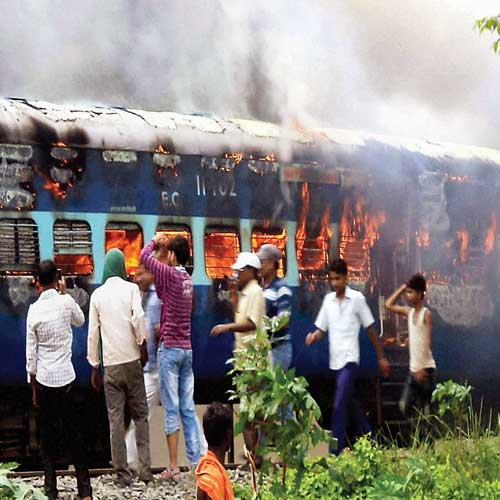 Angry protesters set Raj Rani Express ablaze after it ran over pilgrims at Dhamara station in Khagaria.