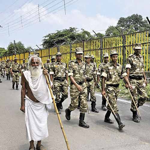 Security personnel patrol a street in Ayodhya on Friday.