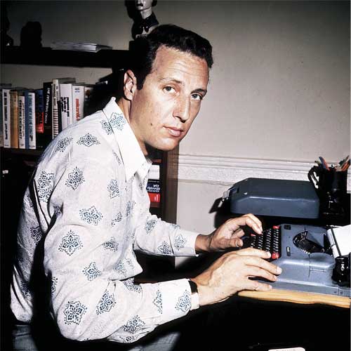 Circa 1970: British author Frederick Forsyth at his typewriter, an instrument he still uses.