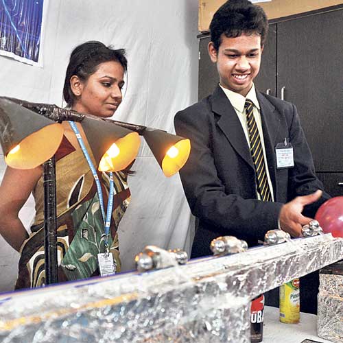 Students display their models during exhibition.
