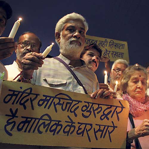 A candle march being taken out in Chandan Nagar on Sunday.