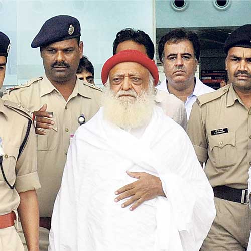 Asaram Bapu at the airport in Bhopal on Thursday.