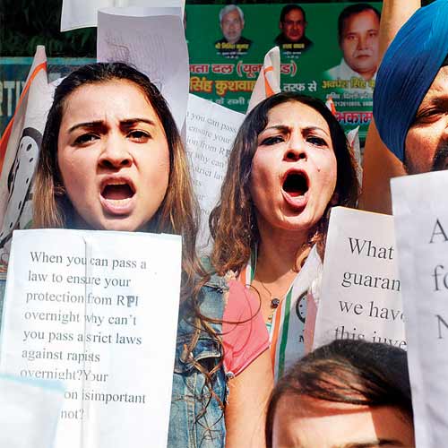Activists in New Delhi on Friday protest against the alleged