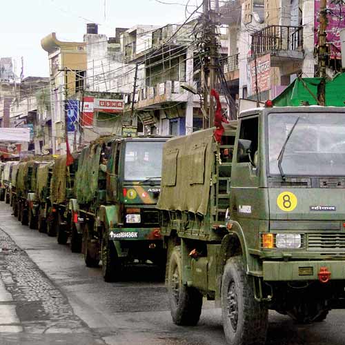 Army vehicles stationed in a curfew-hit area of Muzaffarnagar, Uttar Pradesh, on Sunday.