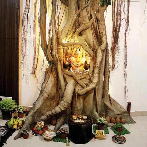 Airoli resident Shekhar Aher's Ganpati idol is made of clay and the nine-feet-tall banyan tree of newspapers and cloth.