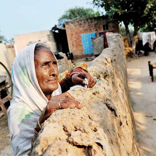 Nabian and her husband (not seen in the picture) are one of a few who have dared to stay back in Laluk village where 14 Muslims died in the recent violence.