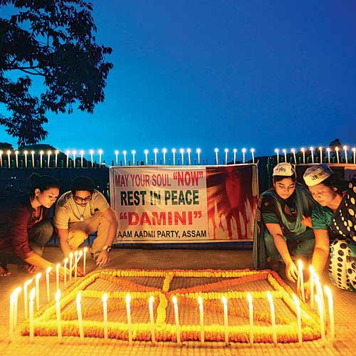 People light candles in Gauhati after the December 16 verdict was pronounced.