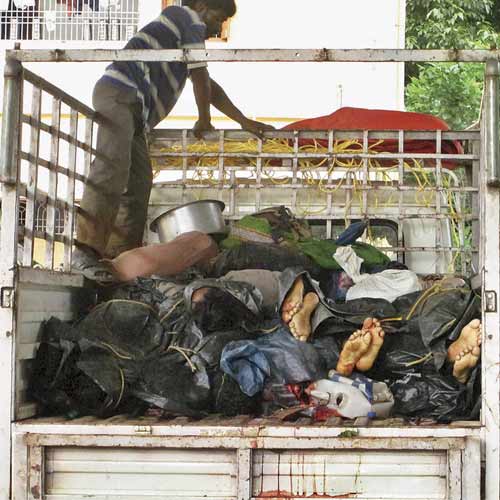 Bodies of Maoists stacked in the back of a truck as they are brought to a hospital for postmortem in Malkangiri on Saturday.