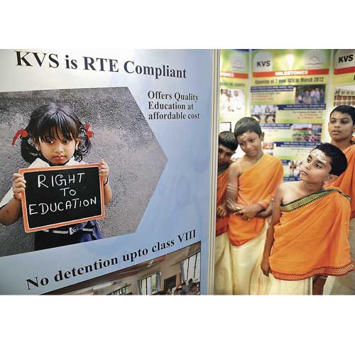 Children admire the travelling photo exhibition in Bangalore on September 17. The exhibition is part of the golden jubilee celebration of Kendriya Vidyalaya Sangathan.