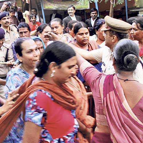 Policemen shoo away eunuchs from court premises on Thursday.