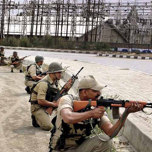 Jawans take position during an encounter after militants opened fire on a convoy of security forces on the outskirts of Srinagar on Saturday.