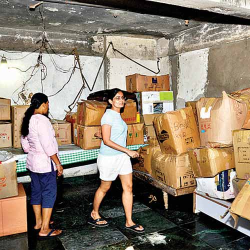 Residents of Esha Ekta Apartments in Campa Cola compound pack up their belongings before vacating the flat.