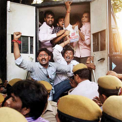 Police detain anti-Telangana activists who were protesting outside the prime minister's residence against bifurcation of Andhra Pradesh, in New Delhi.