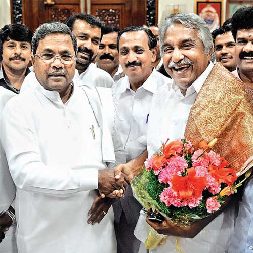 Kerala chief minister Oommen Chandy greets Karnataka chief minister Siddaramaiah at Vidhana Soudha on Thursday.