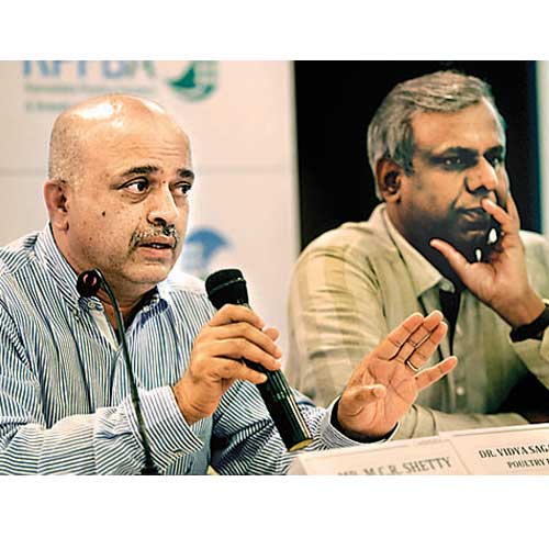 Karnataka poultry farmers' and breeders' association presidetn MCR Shetty (left) and poultry expert Vidya Sagar Punja address media on Thursday.