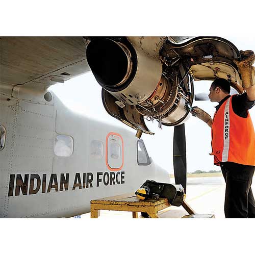 Aircraft maintenance staff work on the engines of the Dornier-228 aircraft of the Indian Airforce standing parked at the Yelahanka Airforce Station in Bangalore The Indian Air Force celebrates its 81st anniversary on October 8.