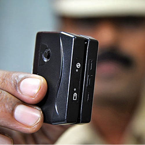 A policeman shows the duplicate ATM swap machine used for getting details of debit cards at Kurla police station on Friday Swapnil.