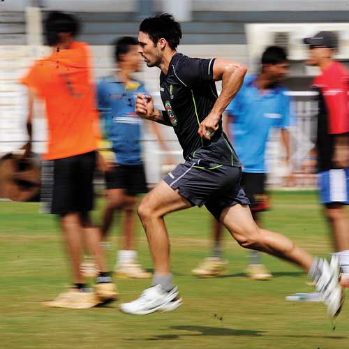 Mitchell Johnson runs in at full throttle at the Brabourne in Mumbai on Tuesday.