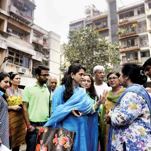 BJP leader Shaina NC interacts with the residents of Campa Cola Compound on Sunday.