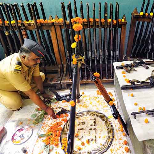 A policeman offers puja at Mumbai Central police station on Sunday.