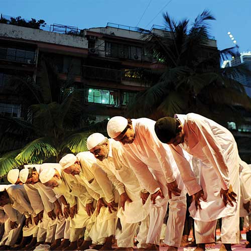 Muslim men offer prayers at Campa Cola compound on Saturday