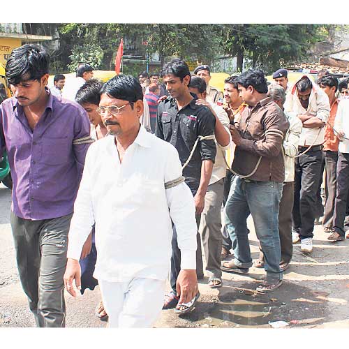 Police paraded accused by tying their hands on Sunday at Sadar Bazaar area.
