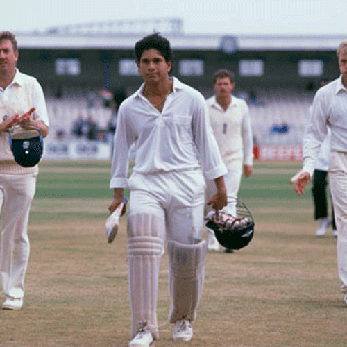 The English team applauds young Sachin Tendulkar (centre) as he returns to the pavilion after a match-saving hundred — the first of his 51 in Test cricket. Getty Images