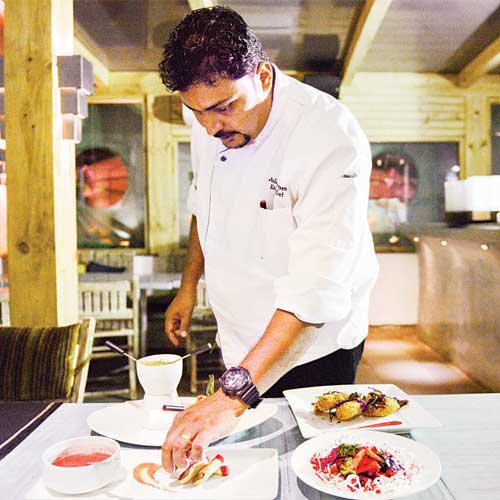 Chef Juliano Rodriques prepares a dish