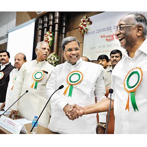 Flanked by speaker Kagodu Thimmappa and minister TB Jayachandra, chief minister Siddaramaiah shares a laugh with legislative council chairman DH Shankaramurthy at the training programme for new legislators, at Vikasa Soudha on Friday.