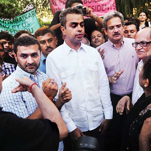 Milind Deora and Rajya Sabha MP Anil Desai speak to Campa Cola supporters at a rally organised at Marine Drive on Friday.