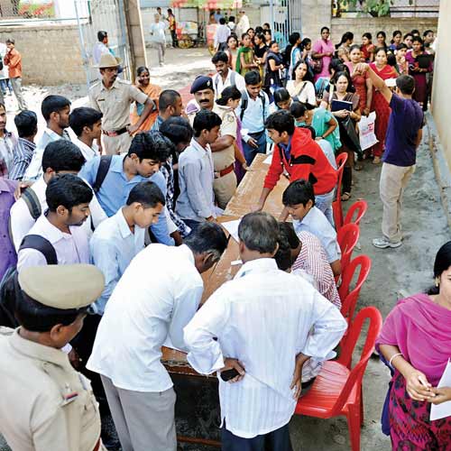 Job aspirants attend walk-in interviews by various companies at Govt PU College at the job fair organised by NA Haris Foundation and Nagamitra Koota on Saturday.